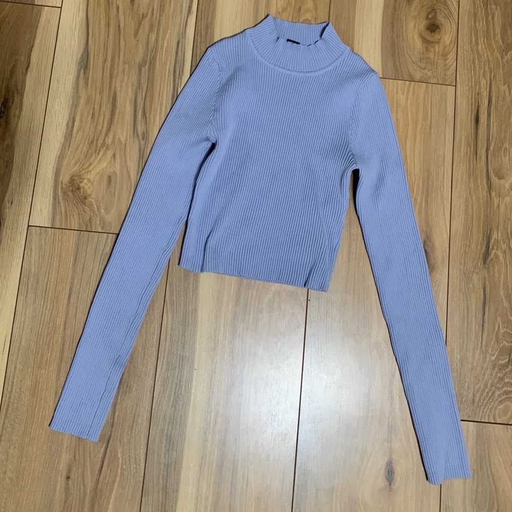 Blue turtleneck with long sleeves and ribbed material